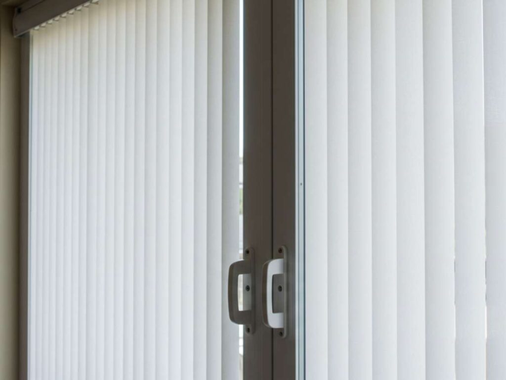 Vertical cellular shades (honeycomb shades) are a top pick for sliding glass doors that need insulation and light control.