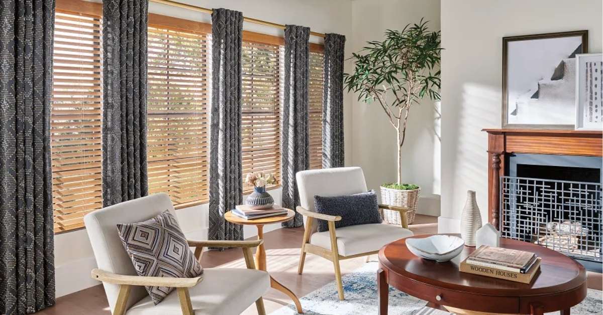 Graber Wood Blinds in living room with patterned drapery