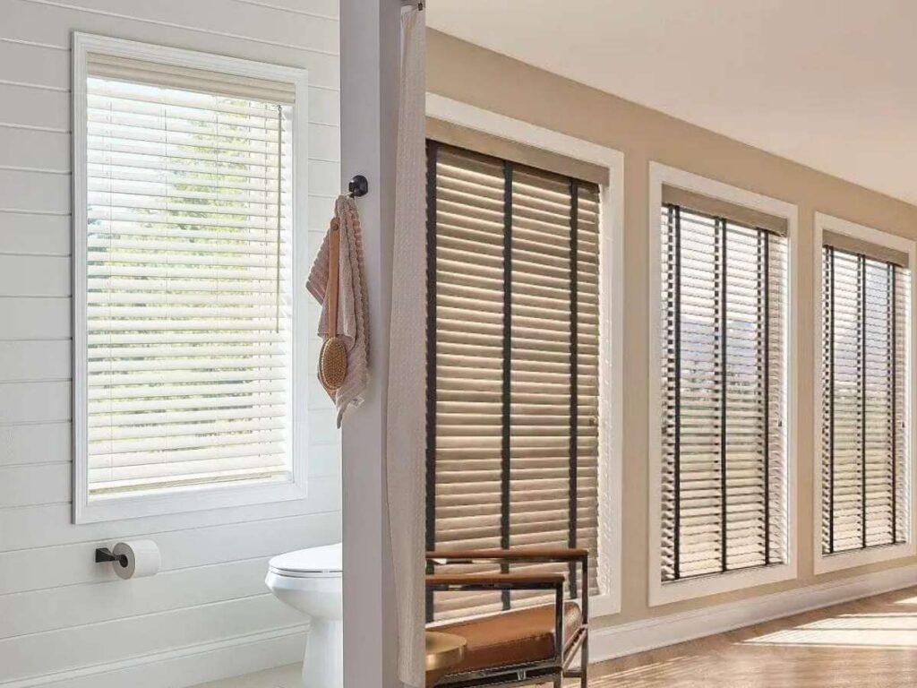 white graber faux wood blinds and graber natural wood blinds in a living room