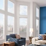 This is a photo of a sheer shades in an oversized window in a living room
