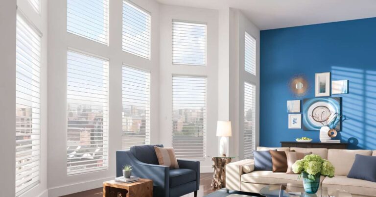 This is a photo of a sheer shades in an oversized window in a living room